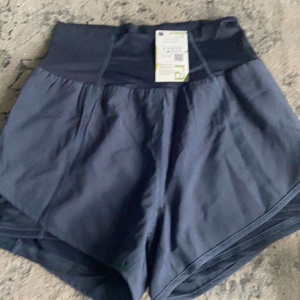 NWT. Sport shorts with built in pocket!